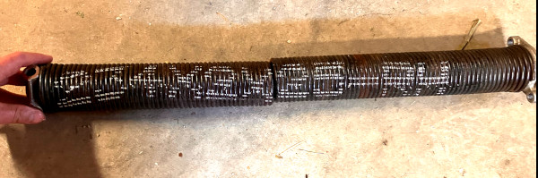 Marquage sur un ressort de porte de garage